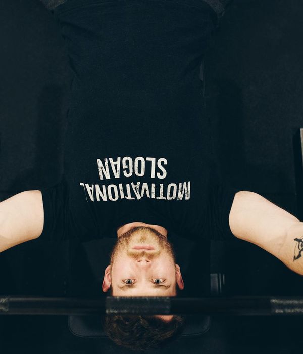 Strong man focused on morning energy practice indoors